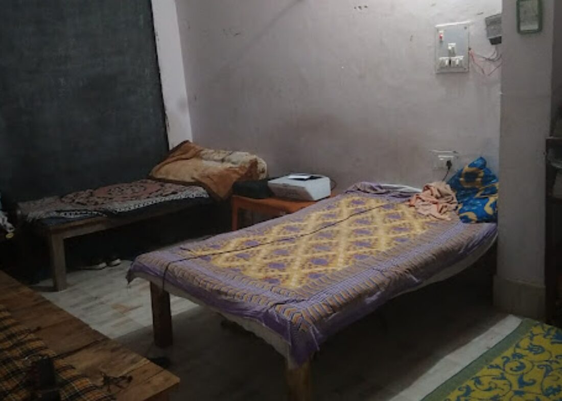 Double sharing room with beds and study table